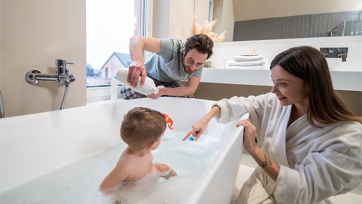 Family bathing child
